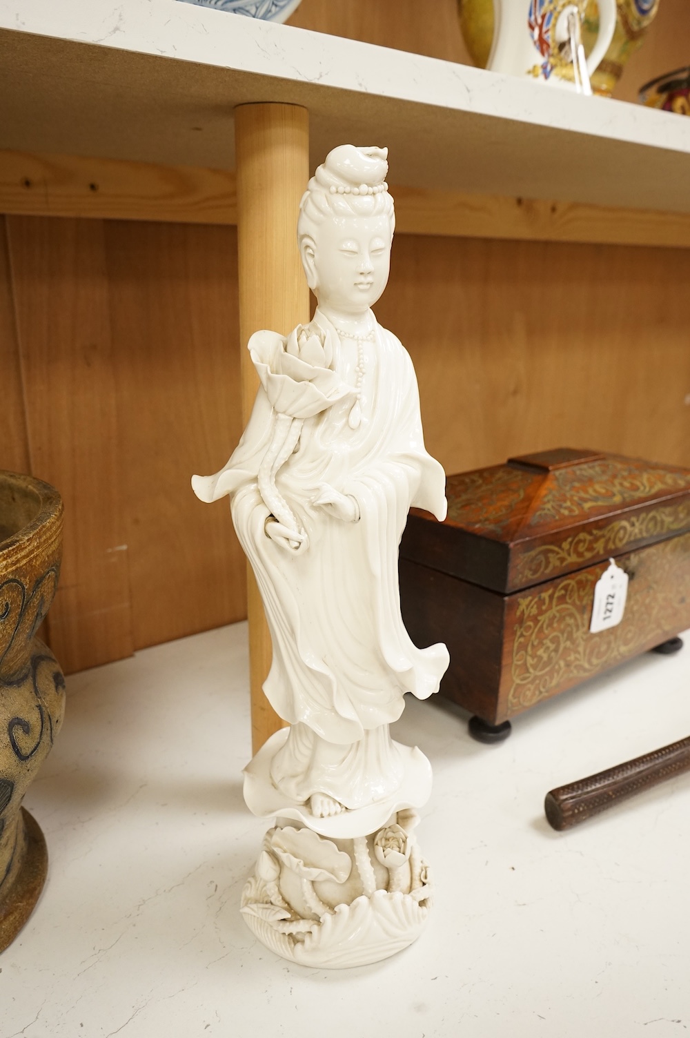 A Chinese blanc de chine figure of Guanyin, 42cm high